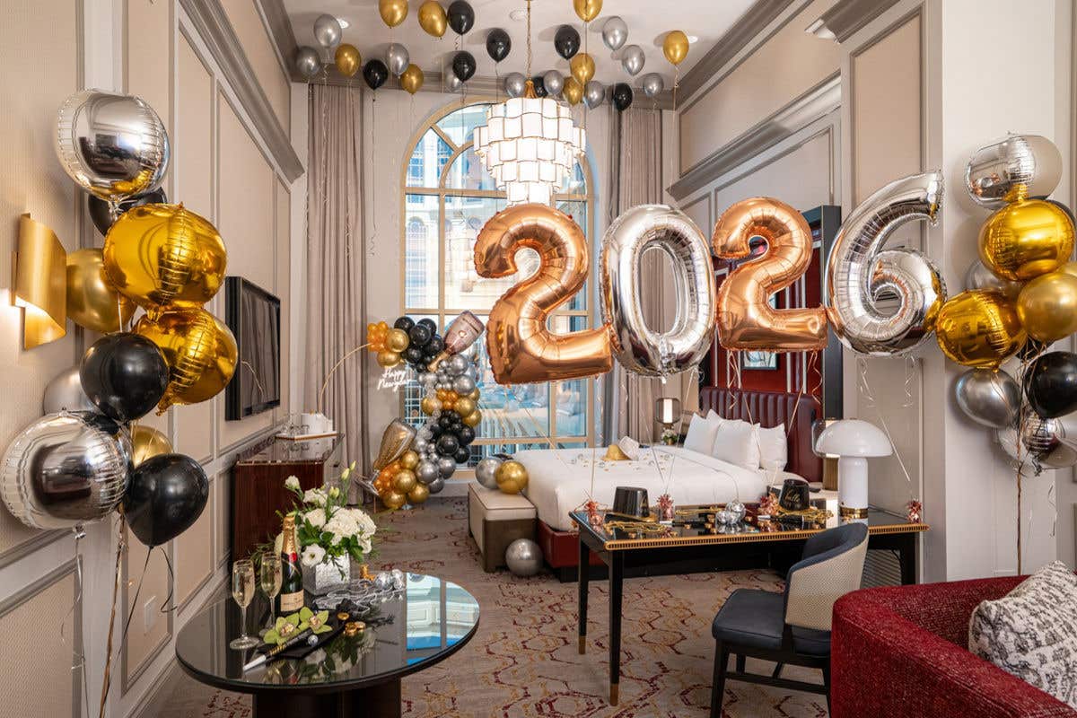 A suite at The Venetian Resort decorated for New Year 2026 celebration with large metallic balloons.