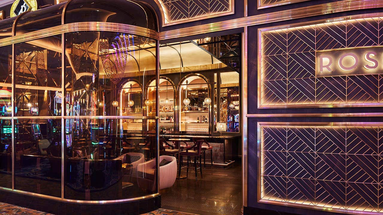 The entry to Rosina, showcasing a glass exterior reflecting to the casino floor.